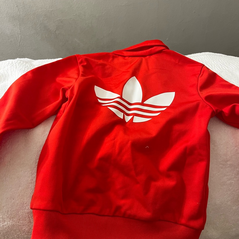 Long sleeve adidas jacket with logo on the front and back